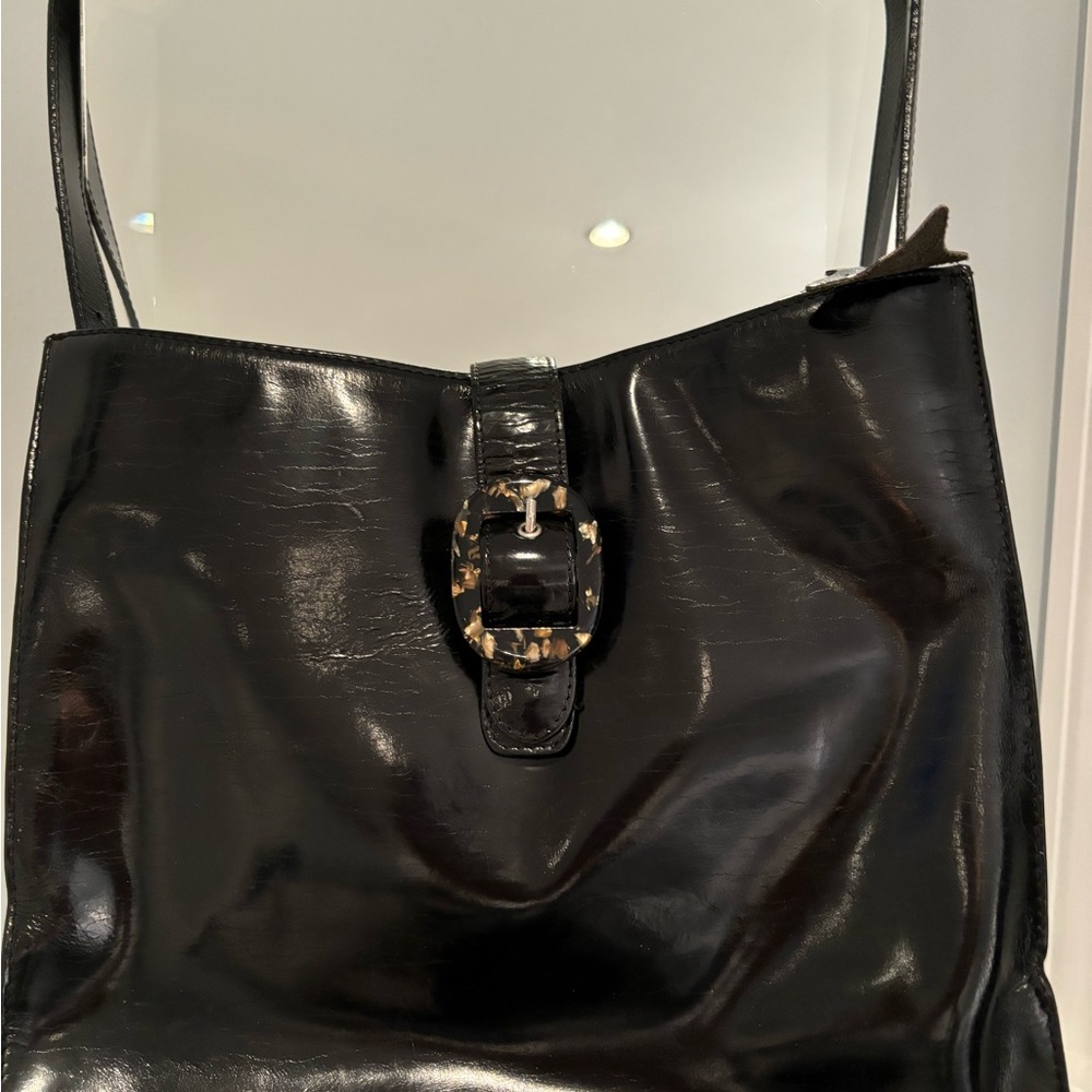 Patent leather pocketbook.